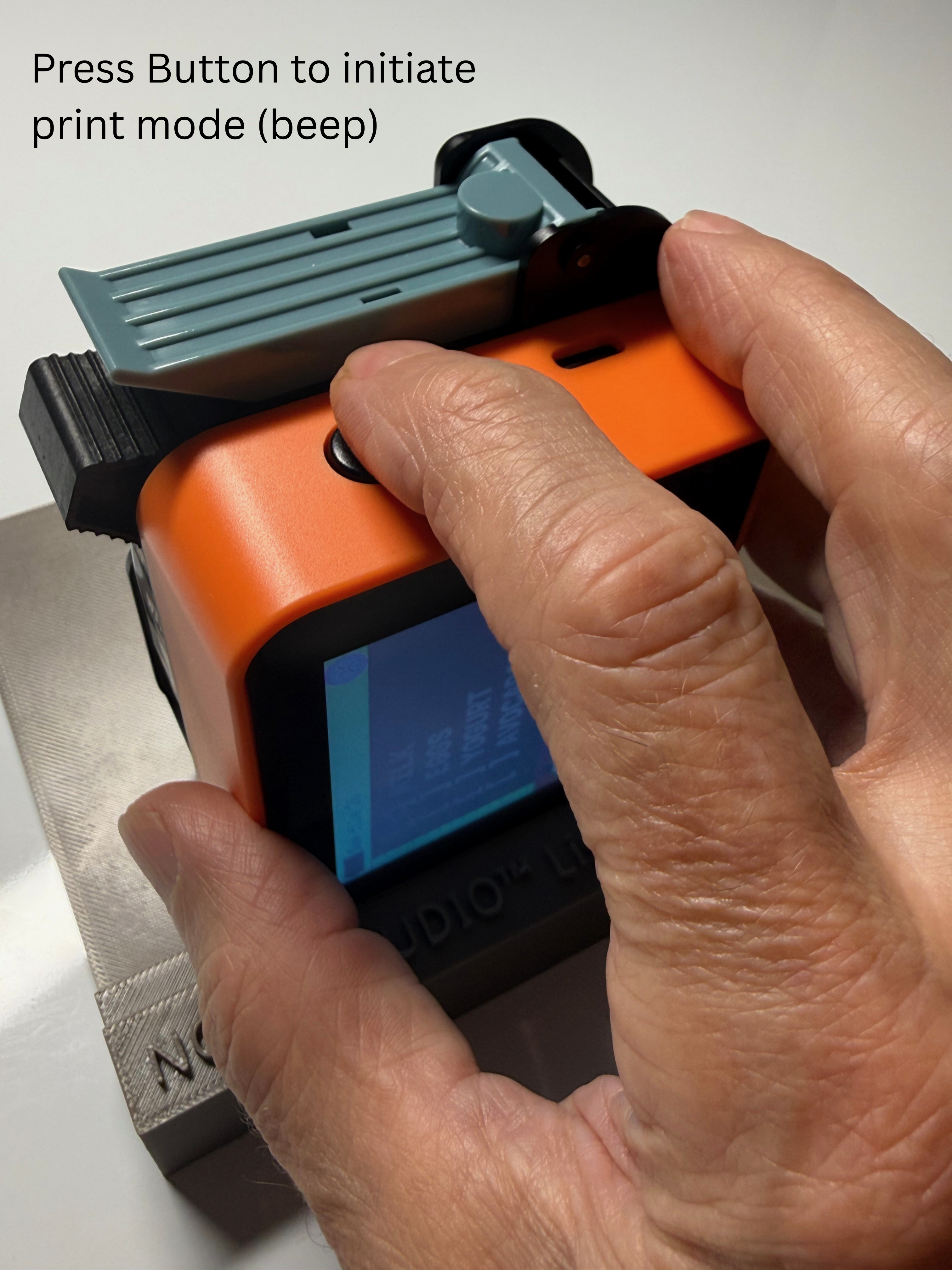 Press the button on top... until you hear a 'beep'