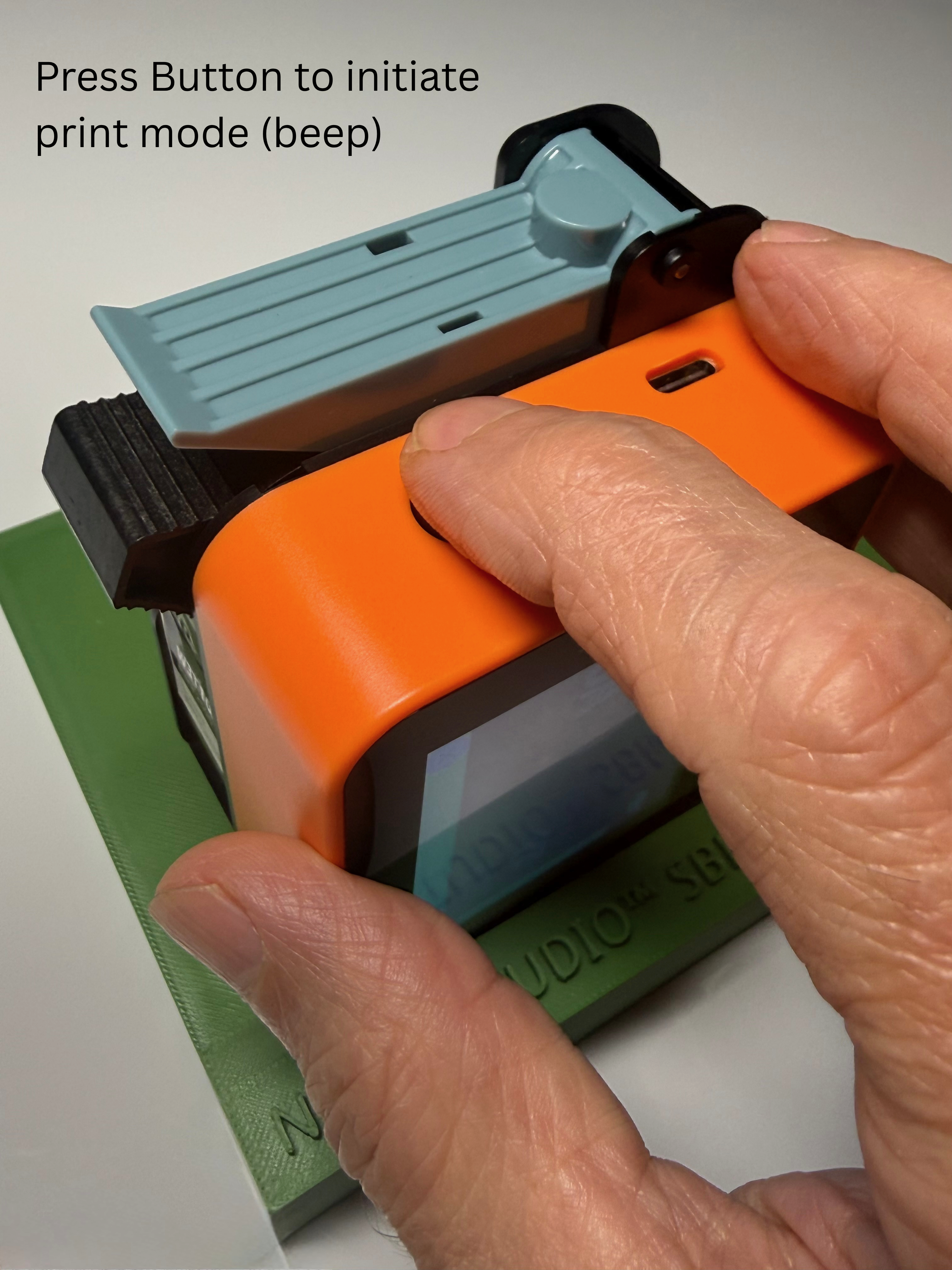 Press the button on top... until you hear a 'beep'